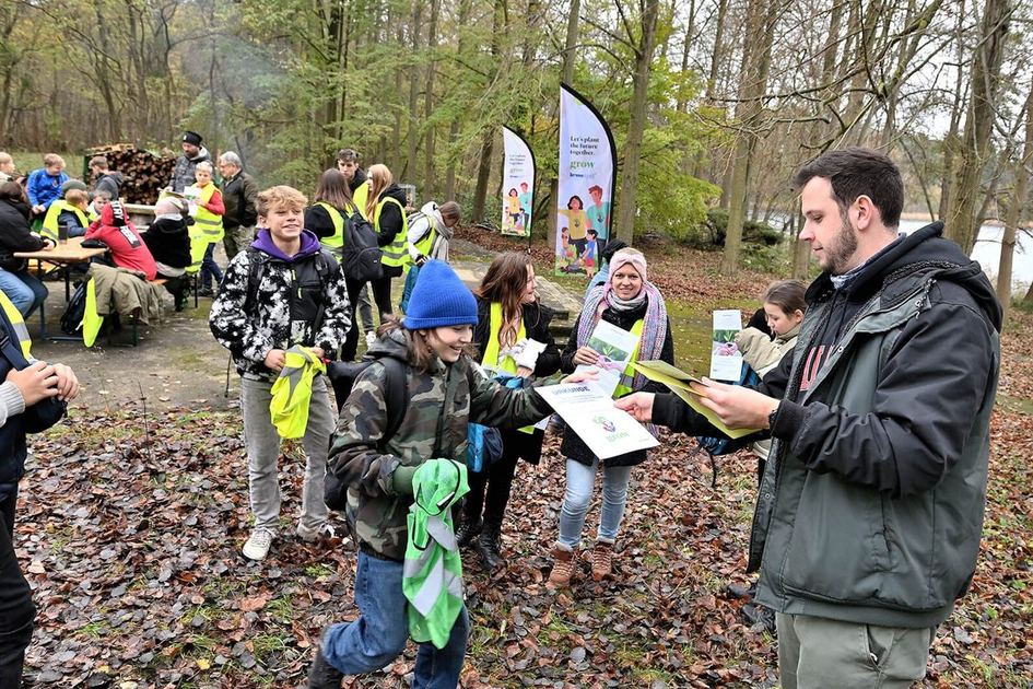 Volunteers planting in an autumn forest